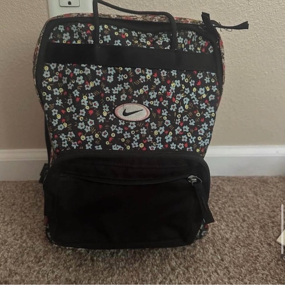 Nike Handbags - Nike Black Backpack with Floral Design